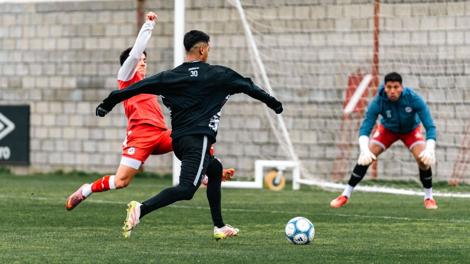 Football players in action during a lively game, focusing on strategy and technique.
